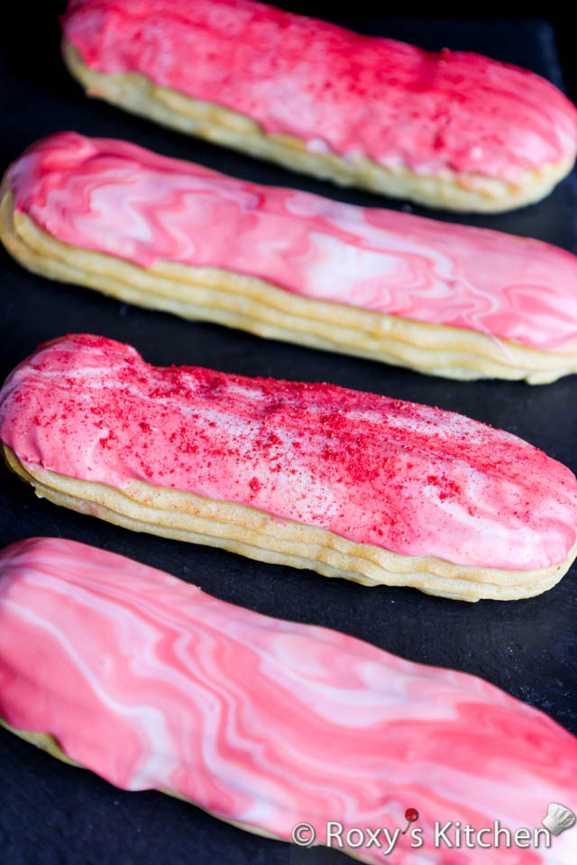 Pink & white eclairs with raspberry powder on top