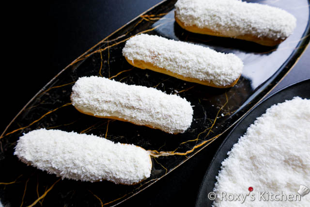 Eclairs topped with white chocolate and coconut 