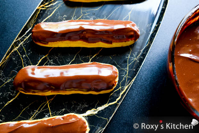 Eclairs topped with dark chocolate 