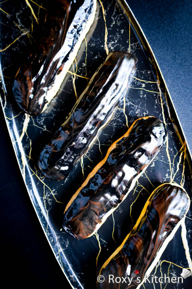 7 Quick, Easy & Elegant Éclair Glazes - Eclairs Topped with a Brown & Black Chocolate Glaze with a Marbled / Swirled Effect 