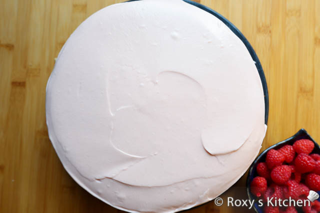Evenly cover the layer with 1/3 of the raspberry filling.