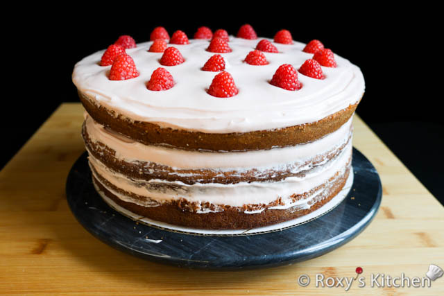 Vanilla cake filled with raspberry cream cheese buttercream and fresh raspberries. 