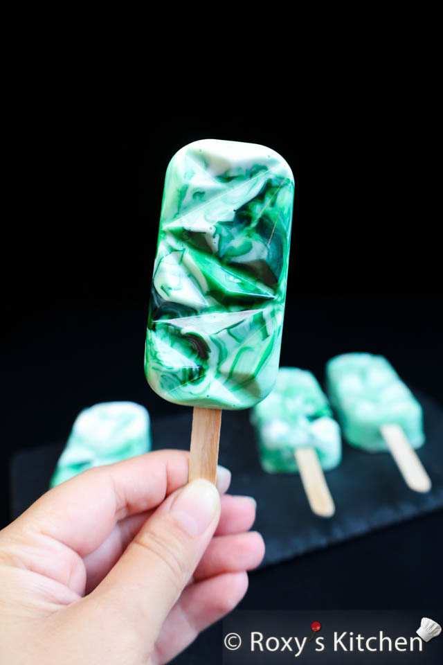 Green & White Marbled Cakesicles -  Learn how to make Soccer-Themed Cakesicles. These cakesicles were the first treats to “disappear” at our two soccer-themed birthday parties. 