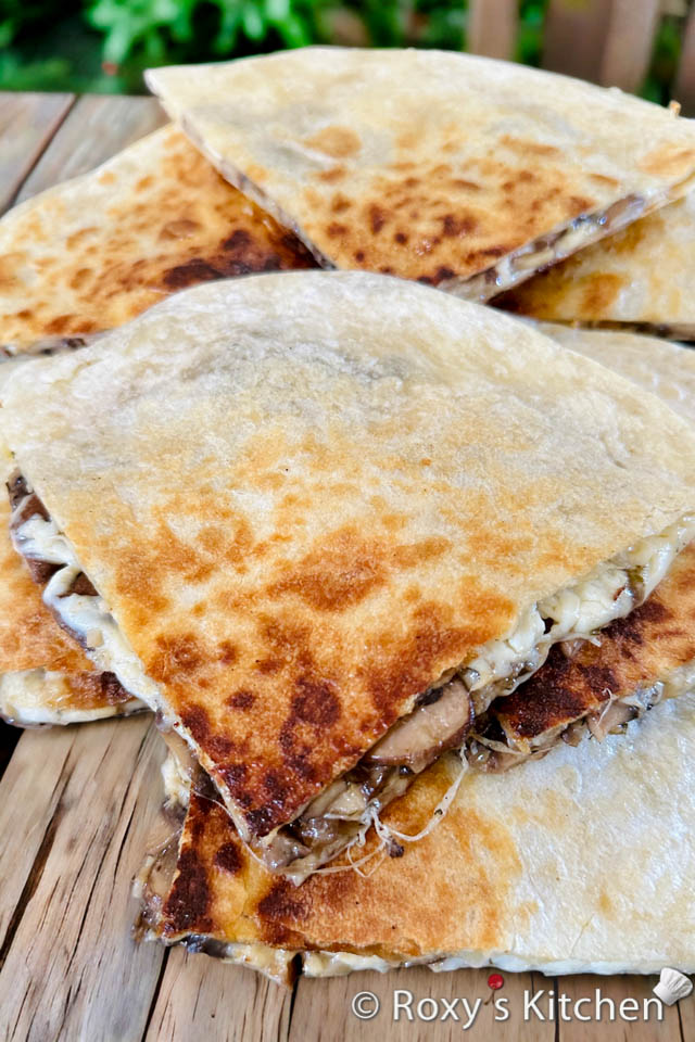 Mushroom Quesadillas - These Mushroom Quesadillas are ideal for a quick lunch, a satisfying snack, or even a casual dinner. These quesadillas are filled with sautéed mushrooms, which bring a meaty texture and rich flavour, complemented beautifully by the smooth, melting cheese. Whether you're a mushroom lover or just looking for a comforting vegetarian option, this recipe is sure to please. 