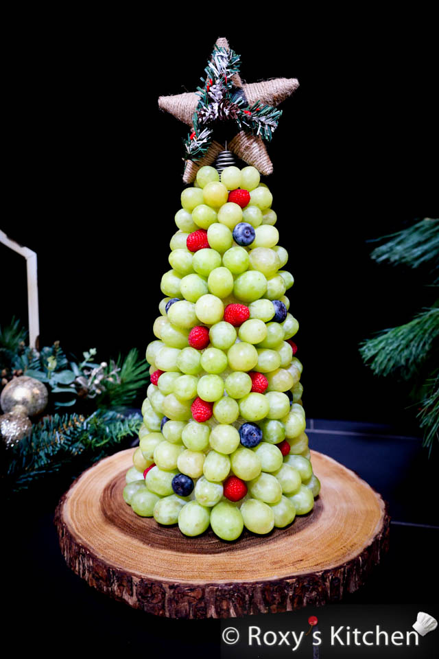 Learn how to craft a delightful Fruitful Christmas Tree adorned with green grapes and the vibrant colours of raspberries and blueberries.