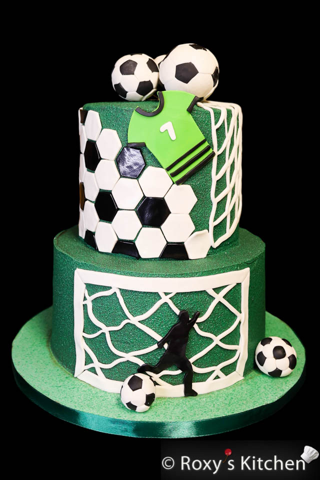 Soccer-themed cake with green turf effect made out of chocolate using a chocolate spray gun