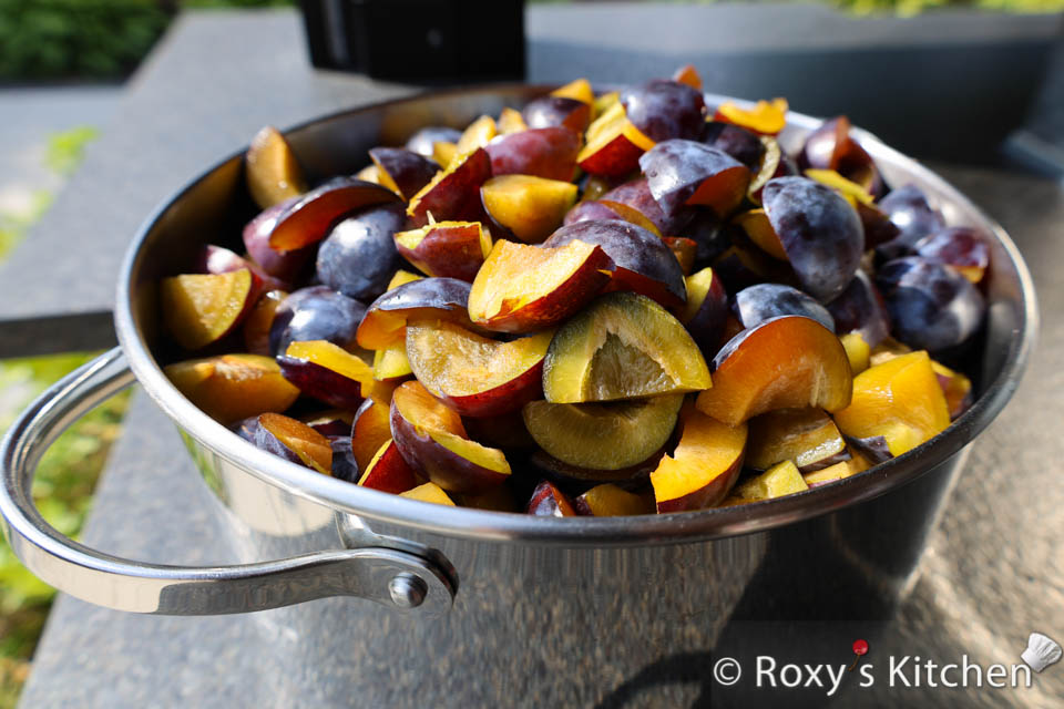 Cut plums in quarters to make plum jam. 