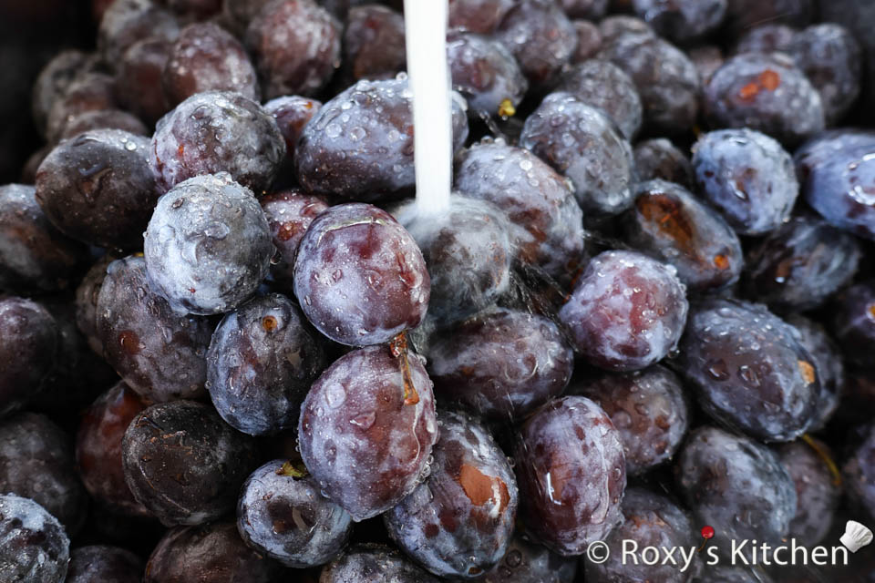 Wash plums for jam. 