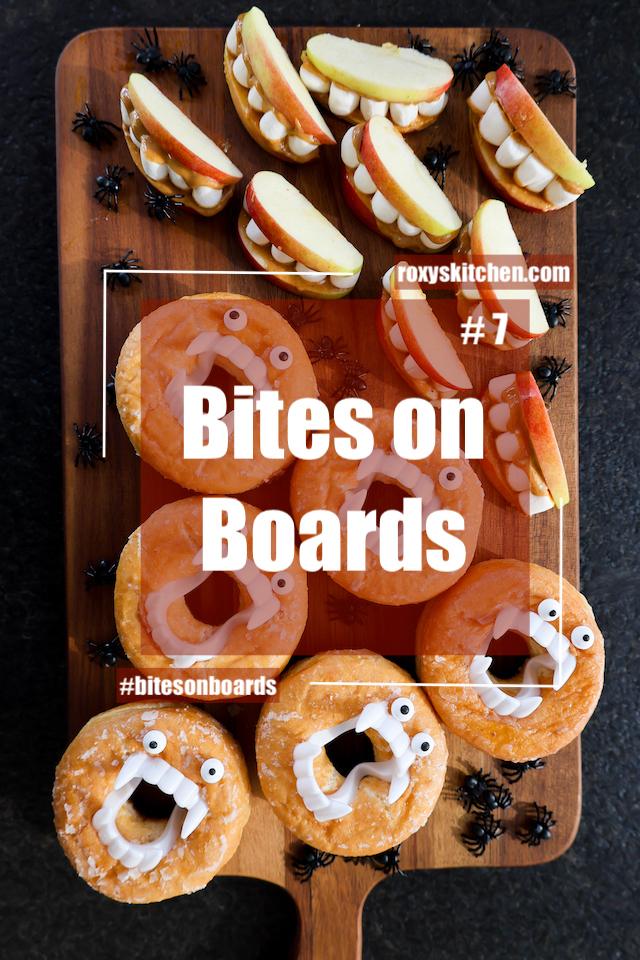 Bites on Boards: # 7 Monster Munchies - If you’re planning a Halloween party or just want to add a little spooky fun to your treats, this Monster Munchies food board is the ultimate choice. Filled with monster doughnuts, apple marshmallow teeth, and creepy-crawly decorations, it’s a hit with kids and adults alike. 