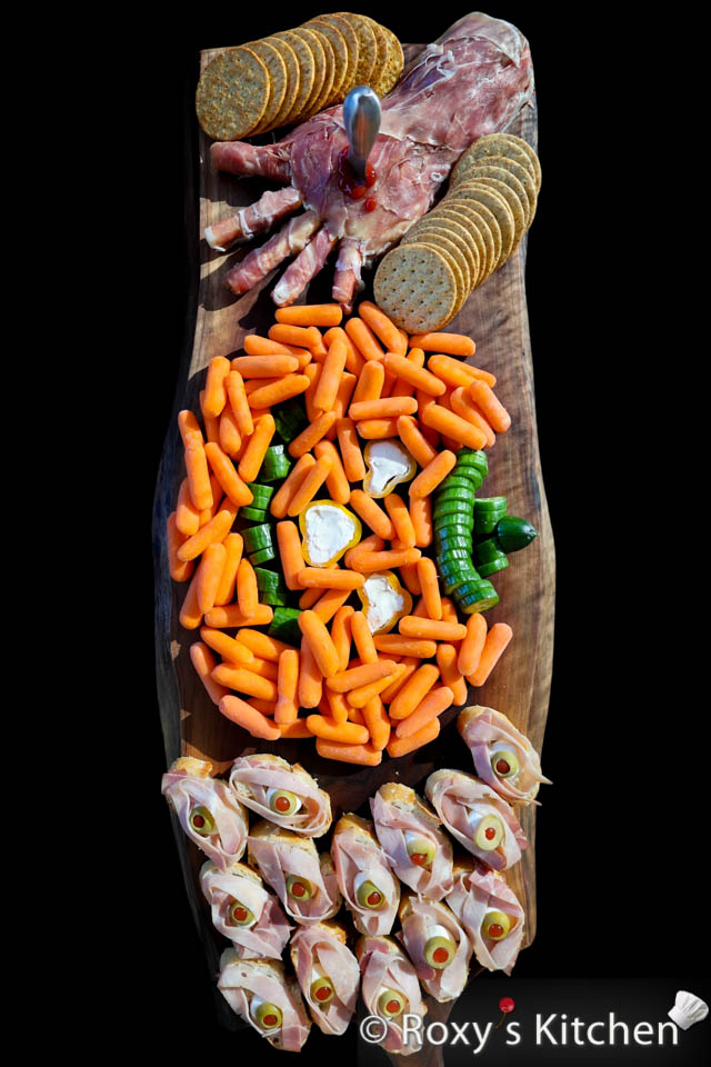 Bites on Boards: # 6 Halloween Haunt - This Halloween Haunt food board is filled with creative and delicious treats that are perfect for celebrating the spooky holiday. 