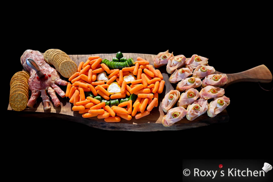 Bites on Boards: # 6 Halloween Haunt - This Halloween Haunt food board is filled with creative and delicious treats that are perfect for celebrating the spooky holiday. 