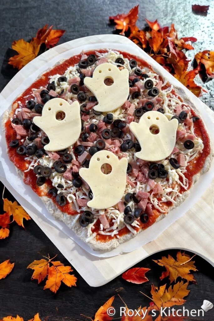 Create a spooktacular Cheese Ghost Pizza for your next gathering with these adorable cheese ghosts that are sure to impress. 