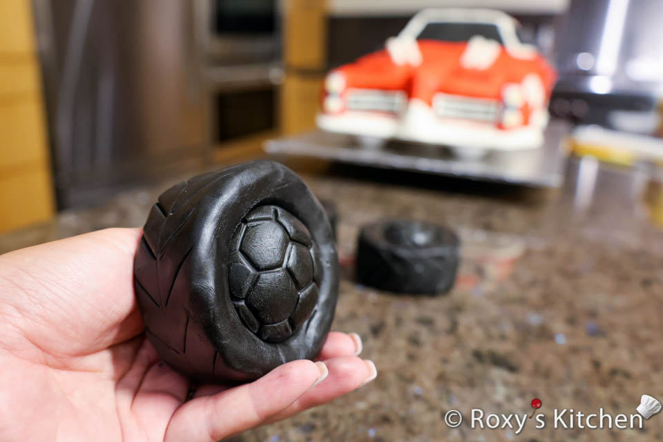 Car tire made out of black modeling chocolate