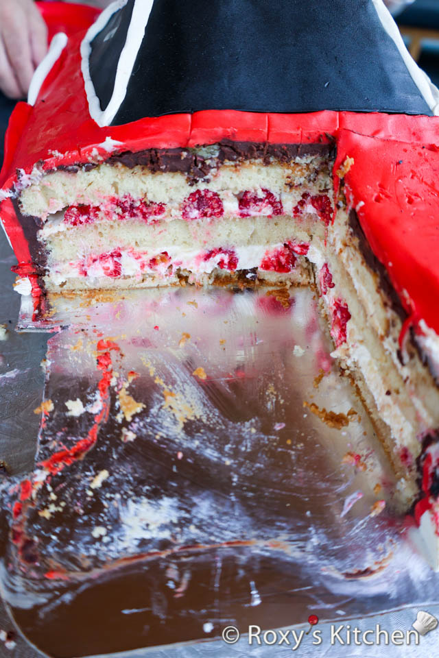 Race Car Cake filled with raspberry cream cheese buttercream and fresh raspberries.